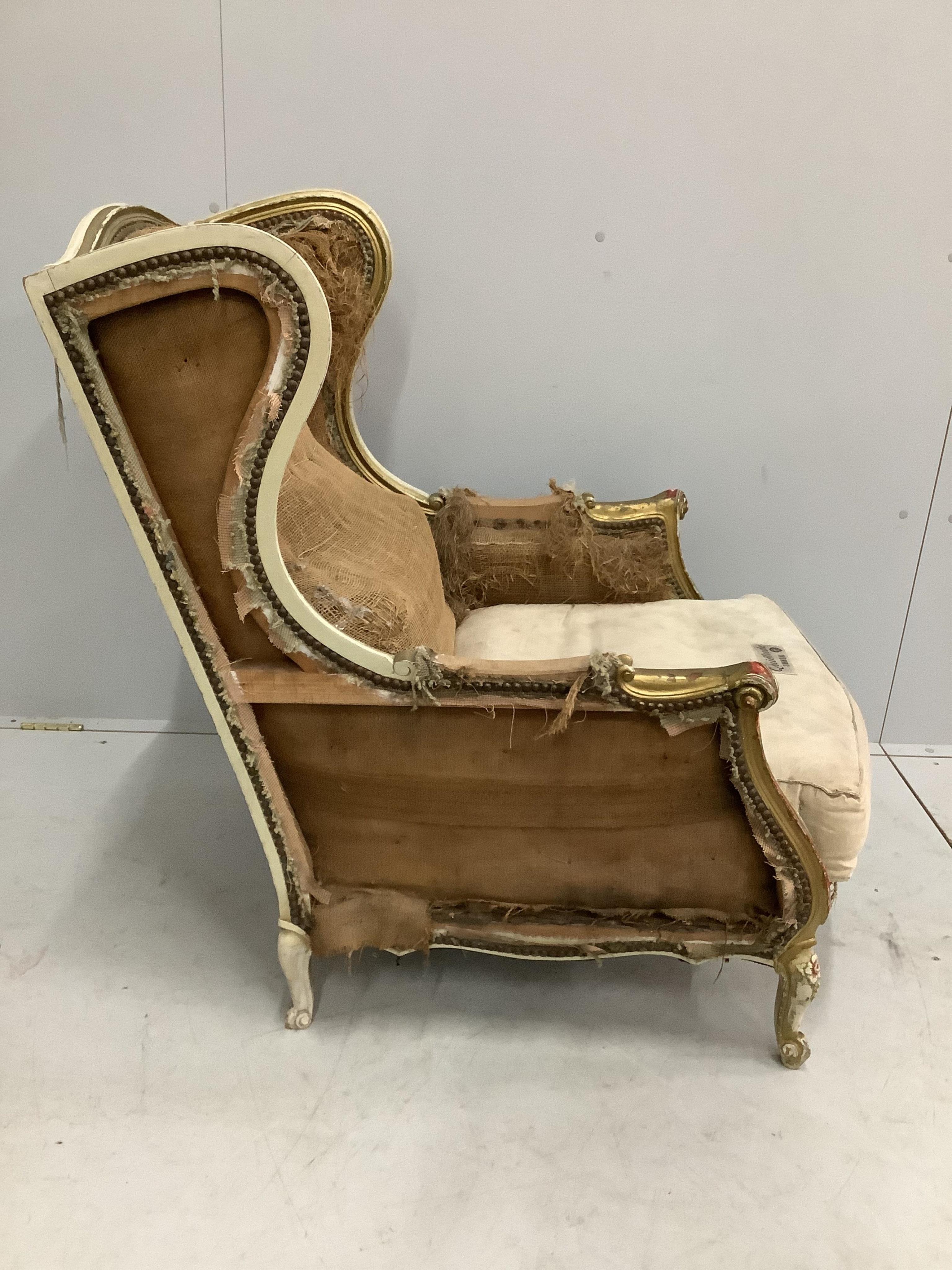 A 19th century French carved giltwood armchair requiring re-upholstery, width 70cm, depth 82cm, height 94cm